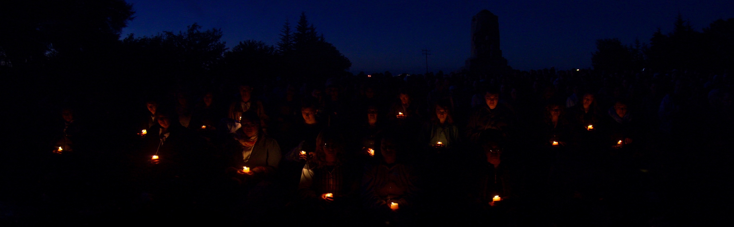 Australians holding candles at a dawn service